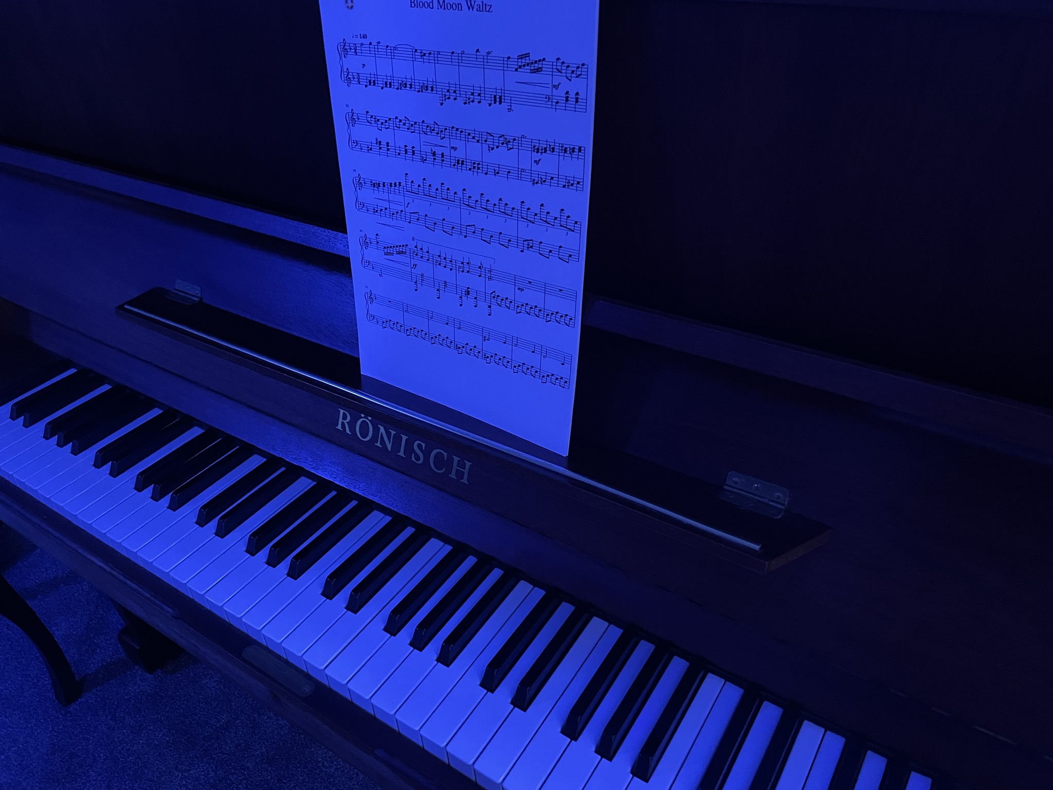 Inspired to Inspire? 1 My piano, bathed in dark blue light in my newly opened studio
