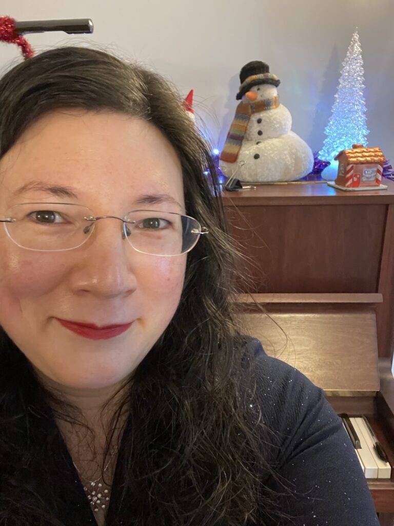 Wishing You a Merry Christmas! 2 A selfie of me in my "electra" popsy dress, with my piano as backdrop. Adorned with Christmas decorations