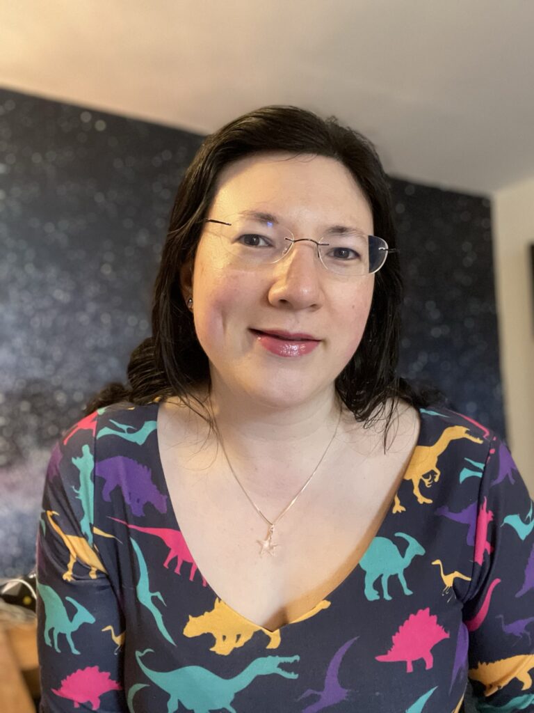 Taking Visibility to a New Level! 2 A selfie of me in my dinosaur dress, having just spoken in a facebook group, being visible!