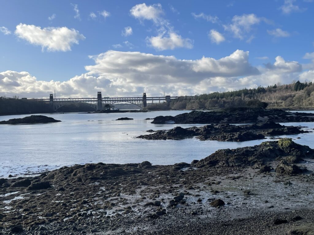 The perfect view across to Britannia Bridge from Church Island, blue skies! 