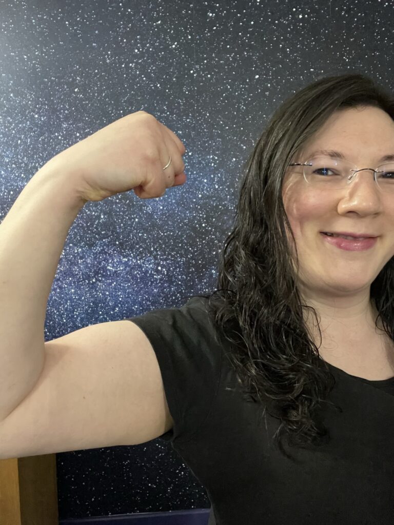 Speaking Opportunities and Collaborations! 3 A selfie of me posing showing strength for International Women's Day.