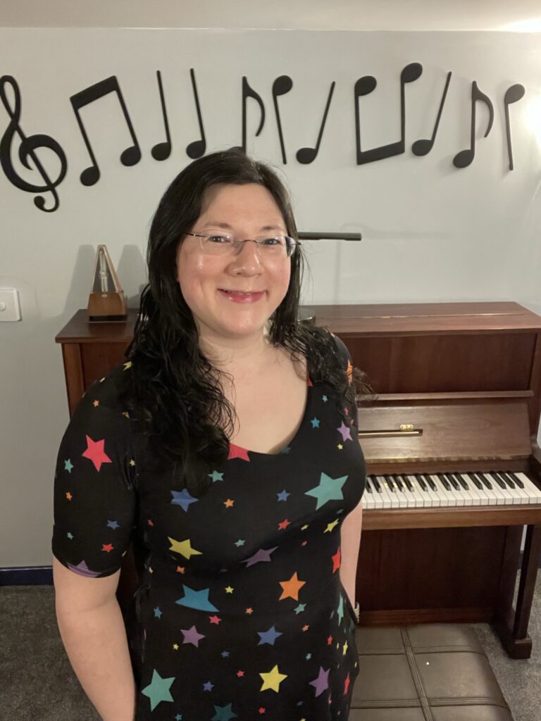 A New chapter begins this term! 3 A selfie of me in my stars dress stood in front of my piano.