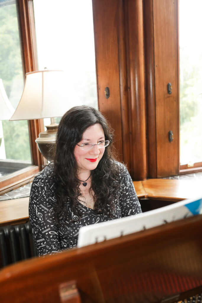 I had a Brand Photoshoot and it was so much fun! 2 a photo of me sitting at the chateau rhianfa piano