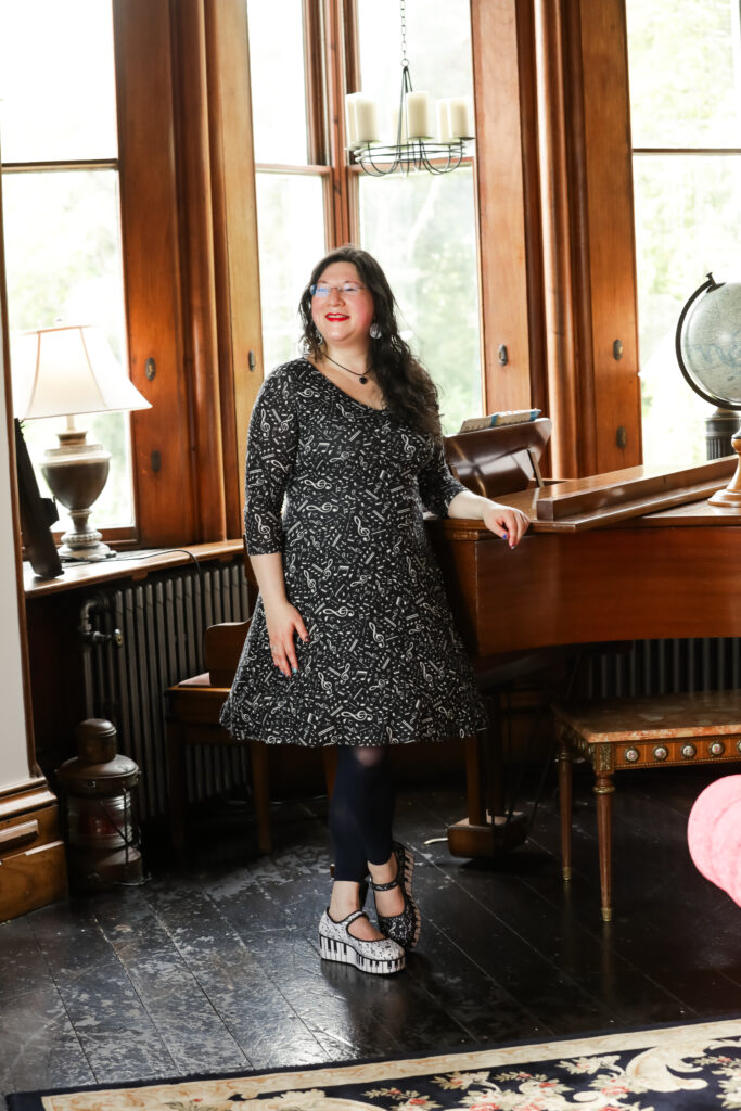 I had a Brand Photoshoot and it was so much fun! 3 a photo of me standing by the chateau rhianfa piano