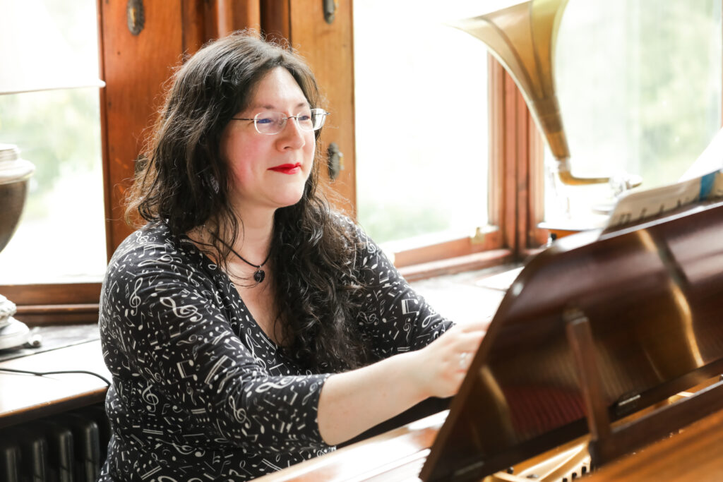 I had a Brand Photoshoot and it was so much fun! 5 a photo of me sitting at the chateau rhianfa piano