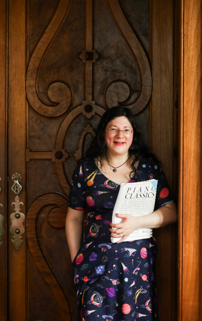 I had a Brand Photoshoot and it was so much fun! 16 a photo of me against an ornate door holding my music.