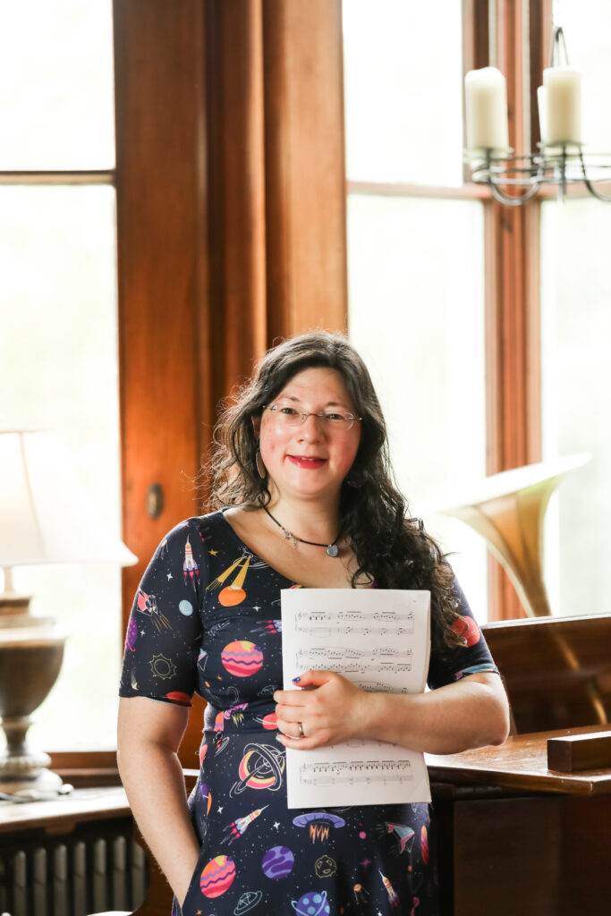 Welcome to the Awesome Hub of the Tropic Pianist Gamer! 2 Jen stood by an ornate grand piano, holding her sheet music, wearing her space themed dress. Welcome to the hub!