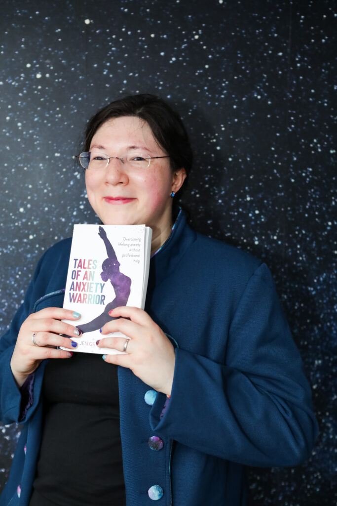 I had a Brand Photoshoot and it was so much fun! 41 I'm beaming while holding my book, in my tailor made jacket, against my Galaxy wallpaper.