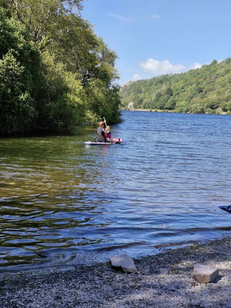 Making the most of the Summer Holidays 2024! 16 Paddling on the paddle board across the lake.