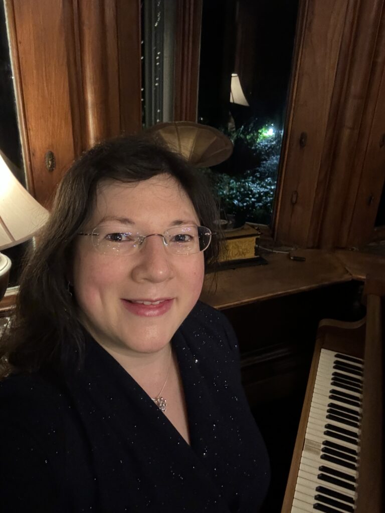 A Level Results, a 20+ year old Memory of Failure... 6 A selfie at the Chateau Rhianfa piano, hair down, navy sparkle dress.