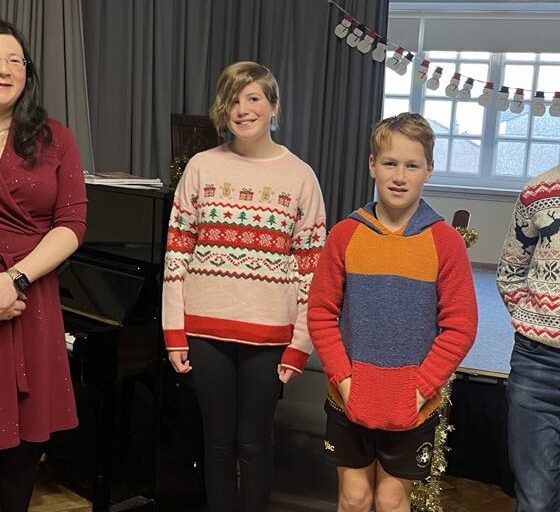 photo of me with my performing students at my concert.