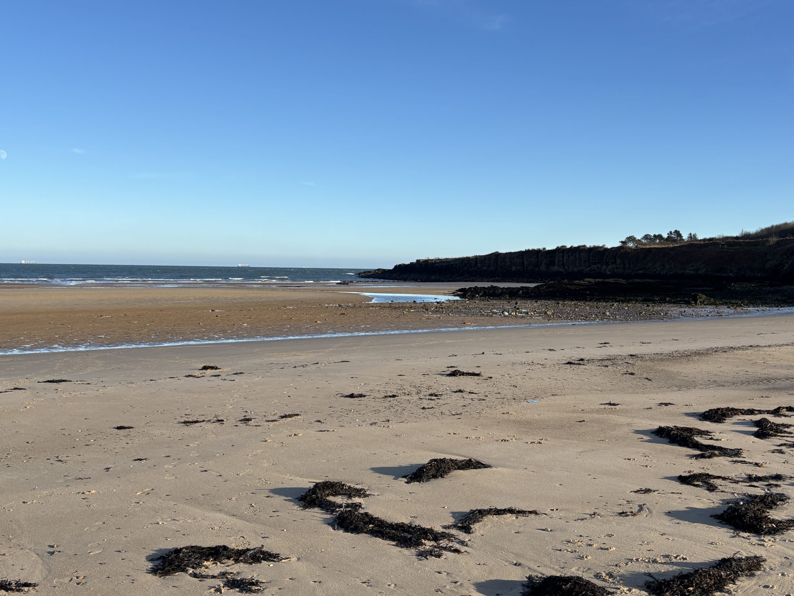 2025- New Year, New Chapter! 1 A shot across Lligwy beach with blue skies