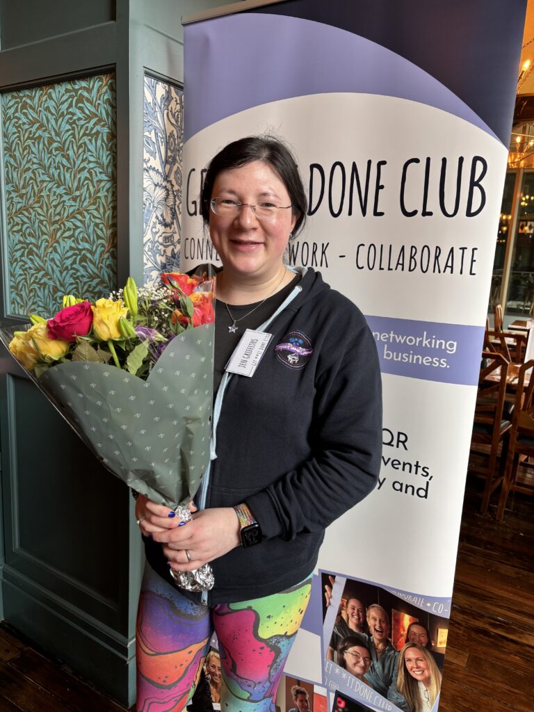 Summer has Started here, Exciting plans ahead! 14 me smiling at the camera with a bunch of colourful flowers that match my colourful leggings.
