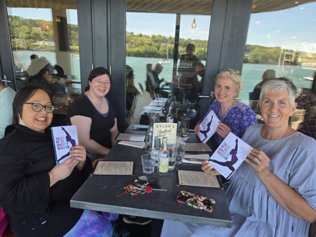 Summer has Started here, Exciting plans ahead! 2 a photo of me with 3 networking friends, showing copies of my book, sat at a table for lunch at Dylan's restaurant. Looking like summer!