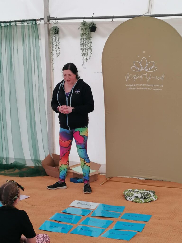 Festivals of 2025 Fulfilled & 3 Public Speaking Goals Smashed! 12 picture of me talking to the audience. Rainbow leggings, branded hoodie.