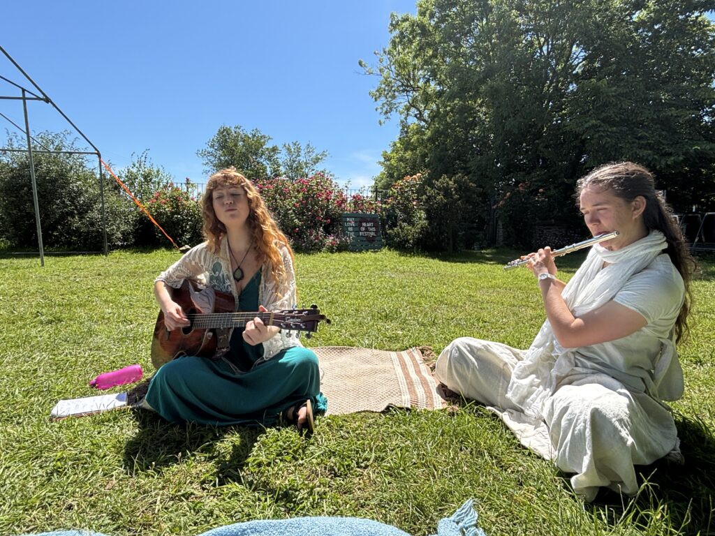 Summer 2026 is a Great Balance! 6 Bexi and Madhurika (on flute) jamming together at the end of the yoga festival