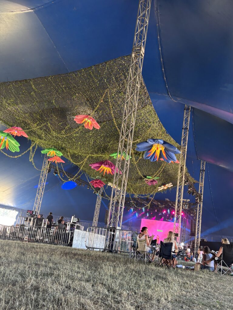 Summer 2026 is a Great Balance! 15 The decorations on the ceiling of the big tent. Colourful flowers!